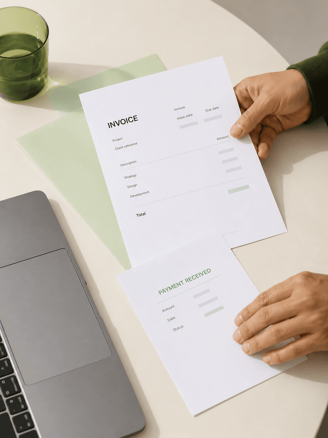 Invoice and payment documents on a small business workspace